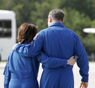 
Endeavour mission specialists Dafydd Williams, right, of the Canadian Space Agency and Barbara Morgan leave   the media gathering at the Kennedy Space Center on Friday.
 (The Spokesman-Review)