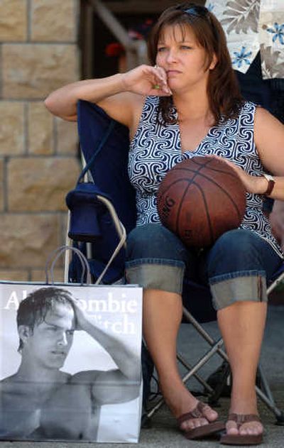 
Marti Harris, of Okanagan, Wash., watches her daughter Carly play. 
 (Ingrid Lindemann / The Spokesman-Review)