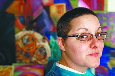 
Stella Mar, an artist and a program director in local radio, is shown at her home. Below is Mar's painting, Flower Now.
 (Jed Conklin photos / The Spokesman-Review)