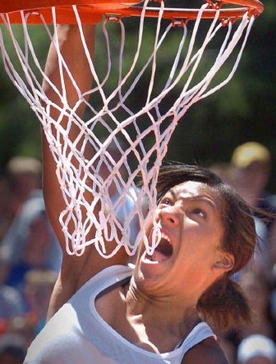 
Women's slam-dunk winner Erin Smith of Chewelah lets out a triumphant yell. 
 (Christopher Anderson / The Spokesman-Review)