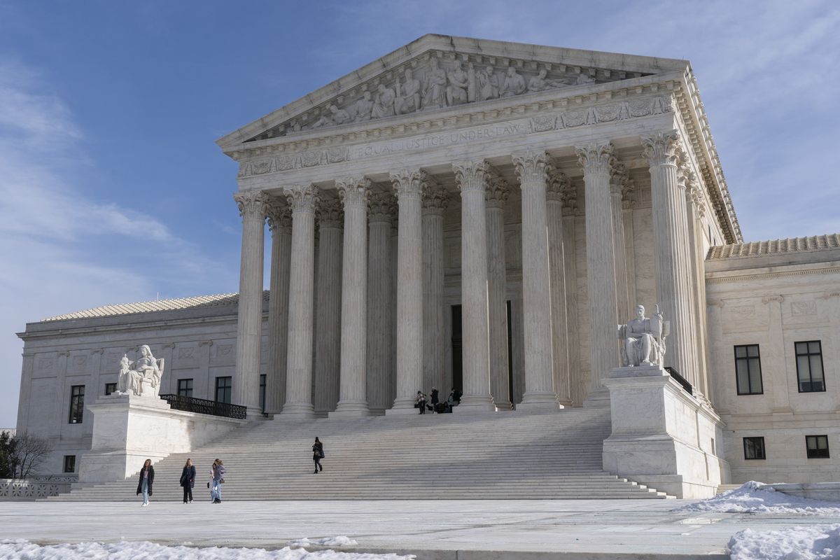 Tourists visit the Supreme Court, Wednesday, Jan., 2022, in Washington. (Jacquelyn Martin)