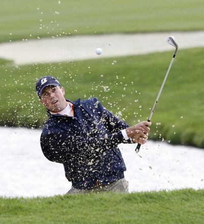 Matt Kuchar hits out of the trap on the 12th during a sudden-death round of the PGA golf Turning Stone Resort Championship. (Associated Press / The Spokesman-Review)
