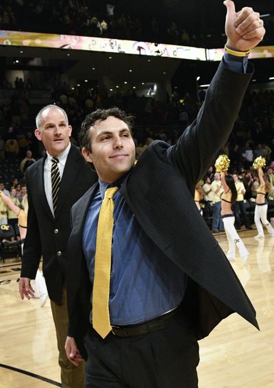 In this Jan. 25, 2017, file photo, Georgia Tech head coach Josh Pastner gestures to fans as he and assistant coach Eric Reveno walk off the court after their 78-56 win over Florida State in an NCAA basketball game in Atlanta. Pastner was expected to win no more than a couple of ACC games in his first season as Georgia Tech’s coach, but the Yellow Jackets have surprisingly beaten two top 10 teams and another in the Top 25. (John Amis / Associated Press)