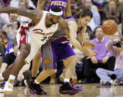 
Cleveland's LeBron James pokes the ball away from Phoenix's Steve Nash during the first quarter Friday night. Associated Press
 (Associated Press / The Spokesman-Review)