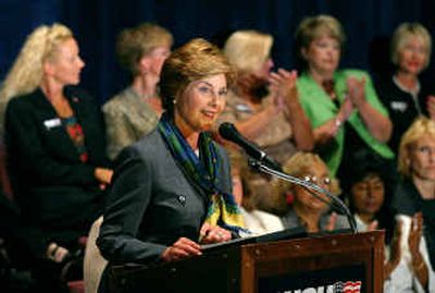 
First lady Laura Bush speaks to a crowd of businesswomen during a campaign stop in Toledo, Ohio, on Monday.
 (Associated Press / The Spokesman-Review)