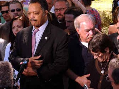 
The Rev. Jesse Jackson talks to reporters while flanked by Terri Schiavo's family on Tuesday.
 (Associated Press / The Spokesman-Review)