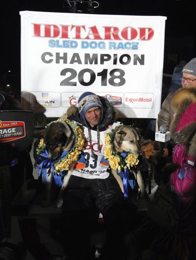 Joar Ulsomposes poses after winning the Iditarod sled dog race. (Diana Haecker / Associated Press)
