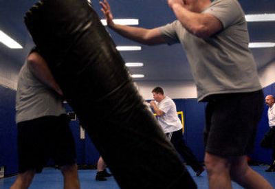 
Spokane Sheriff's Department corrections deputies practice defensive tactics during a training session on Wednesday. 
 (Photo by BRIAN PLONKA / The Spokesman-Review)