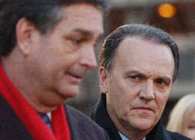 
Former HealthSouth CEO Richard Scrushy, right, looks on as his attorney Jim Parkman, left, answers questions from reporters outside of a federal courthouse in Birmingham, Ala., on Friday.
 (Associated Press / The Spokesman-Review)
