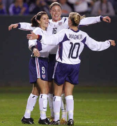 
Mia Hamm, left, celebrates a goal by Aly Wagner, right, along with Abby Wambach during the first half against Mexico.
 (Associated Press / The Spokesman-Review)