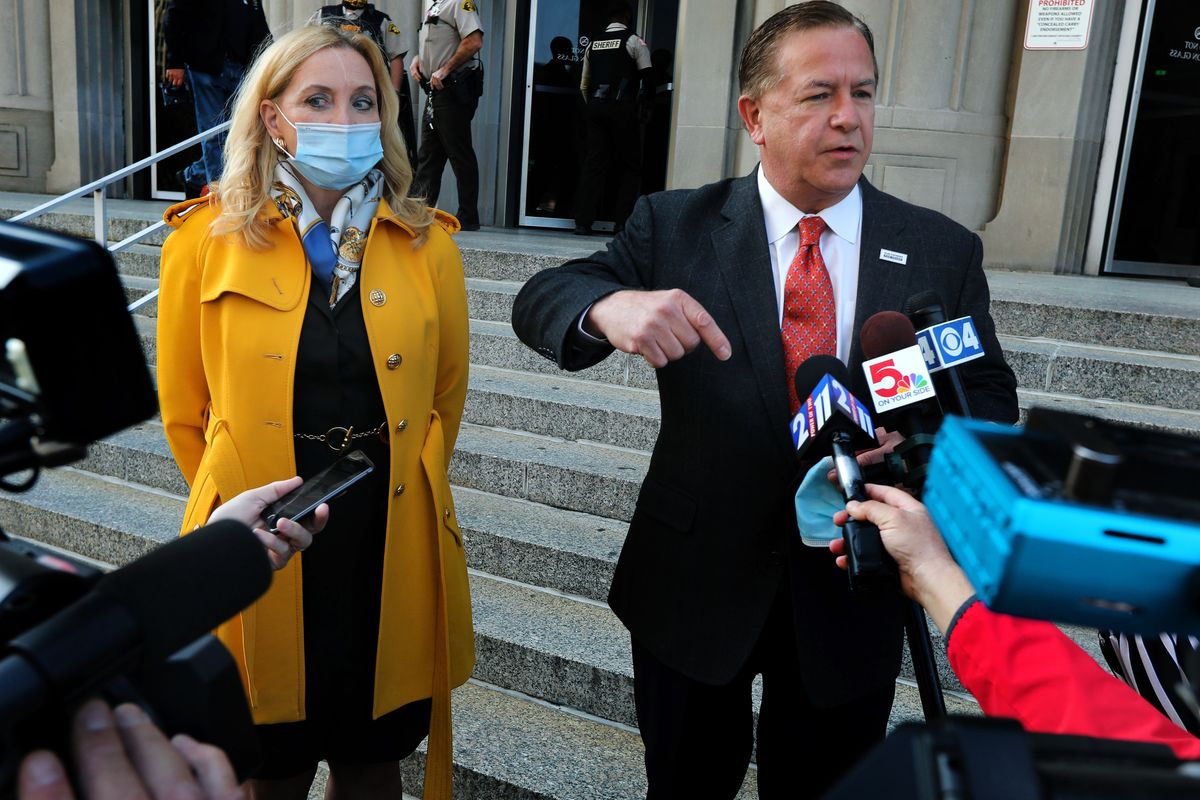 Mark McCloskey addresses the press alongside his wife Patricia on Tuesday, Oct. 6, 2020, outside the Carnahan Courthouse, in St. Louis, Mo. The couple