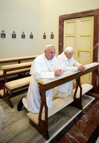 Pope Francis, left, and Pope emeritus Benedict XVI pray together in Castel Gandolfo on March 23, 2013. (Uncredited / L’Osservatore Romano)