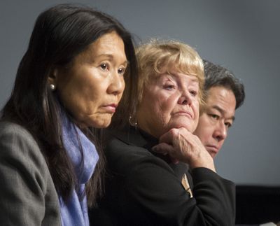 Members of the Washington State Liquor Control Board, from left, Ruthann Kurose, Sharon Foster and Chris Marr, listen during a public forum on implementing I-502 at the Spokane Convention Center on Tuesday. (Colin Mulvany)