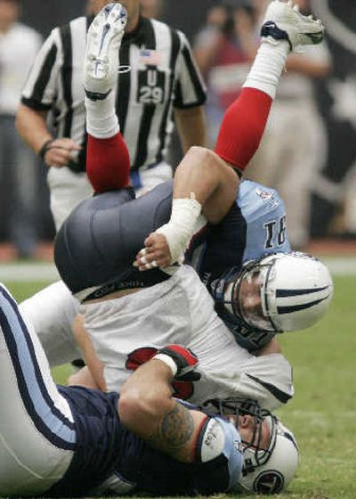 
Houston quarterback David Carr has been sacked 27 times already this season.
 (Associated Press / The Spokesman-Review)