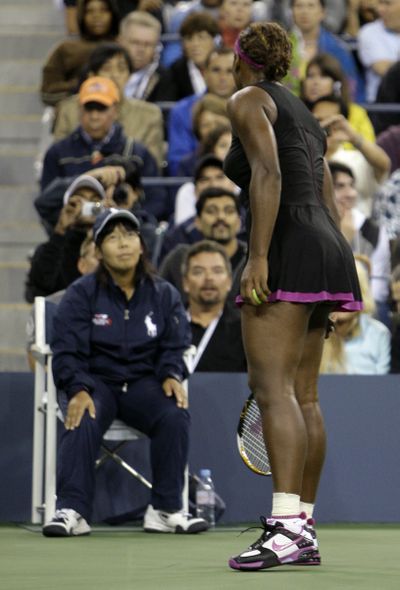 Serena Williams argues with a line judge over a foot fault call during her match against Kim Clijsters. (Associated Press / The Spokesman-Review)