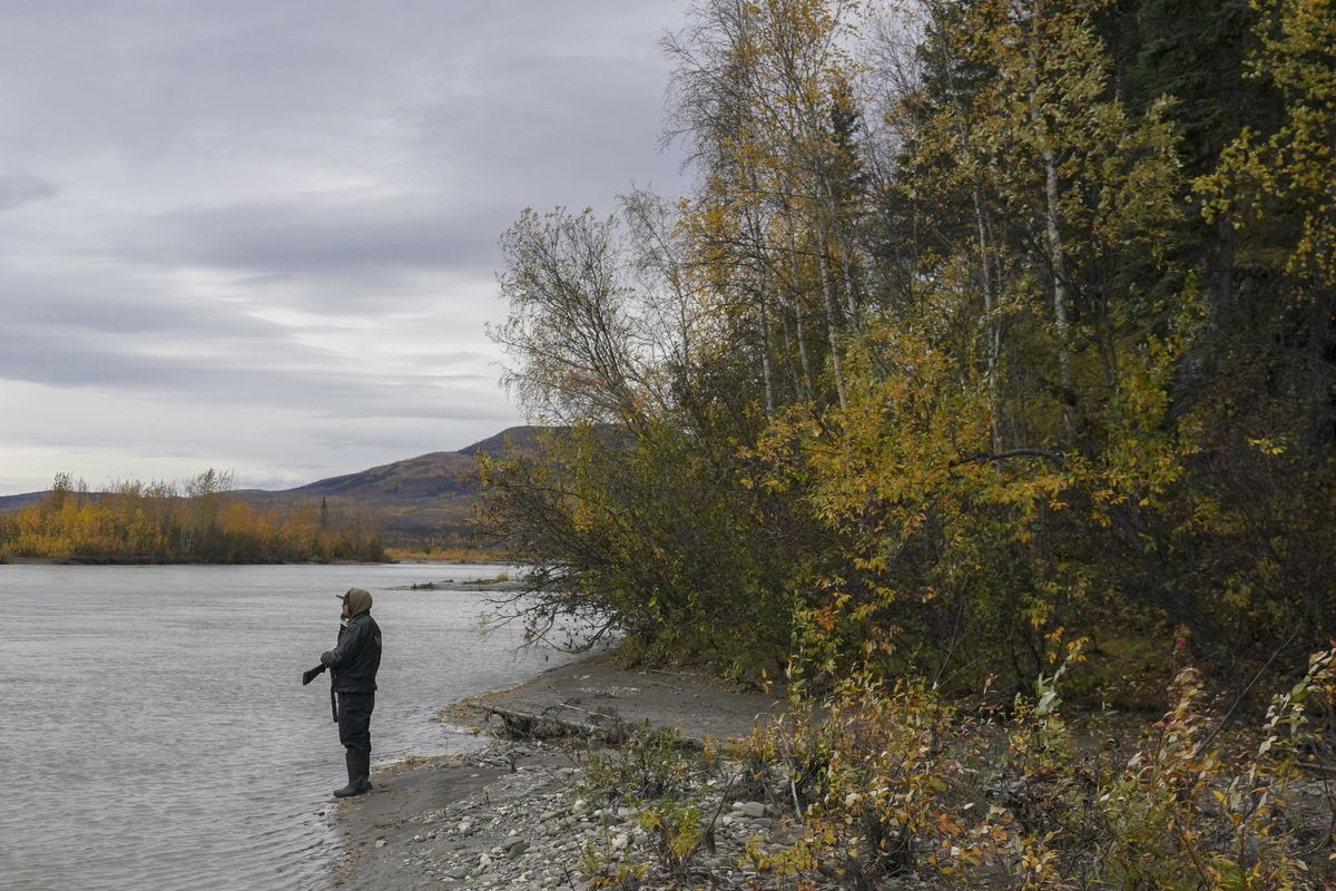 Solomon Yatlin stands near the sacred site of Eagle Rock in Bettles, Alaska. Yatlin, an Alaskan Athabaskan, is concerned that the Ambler Access Road will damage the environment and wildlife migrations.  (Bonnie Jo Mount/The Washington Post)