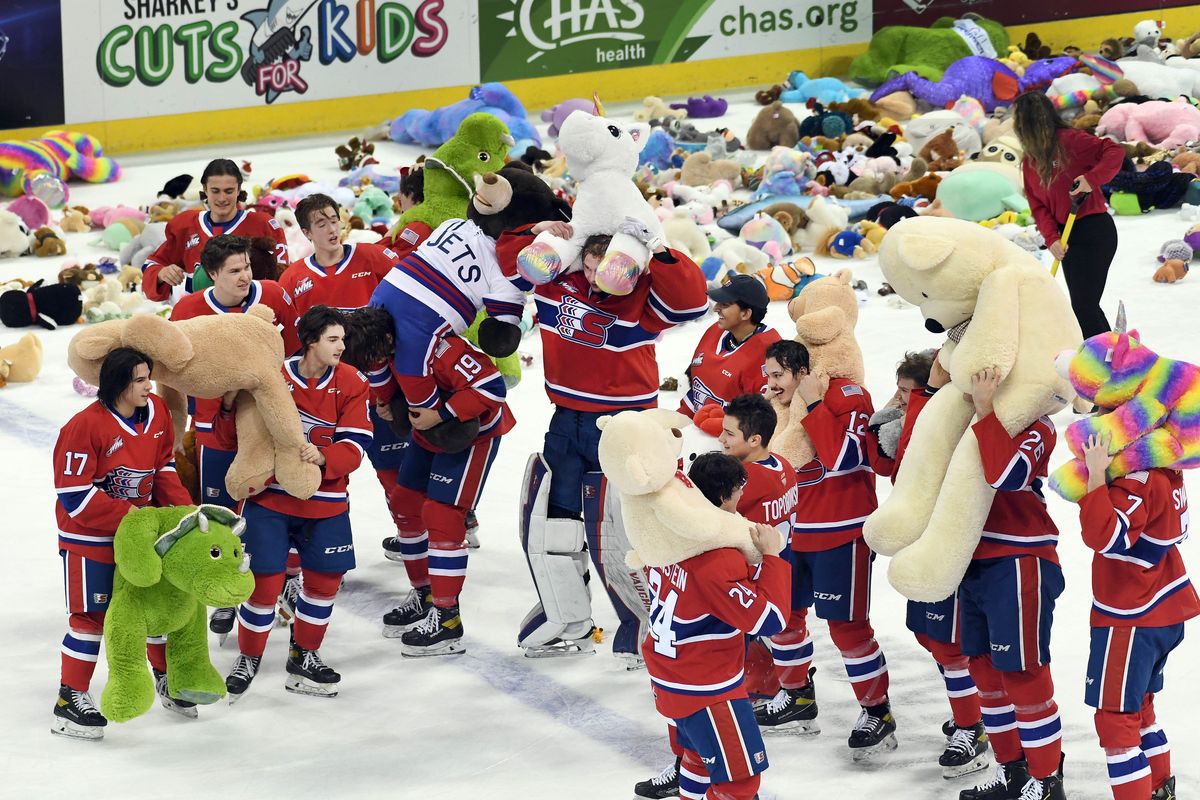 The Spokane Chiefs have some fun with some of the large stuffed animals that were thrown onto the ice during the annual Teddy Bear Toss during the first period of a WHL hockey match with Seattle, Saturday, Dec. 4, 2021, in the Spokane Arena. The 2022 Teddy Bear Toss for the Christmas Fund will be held Saturday.  (COLIN MULVANY/THE SPOKESMAN-REVIEW)