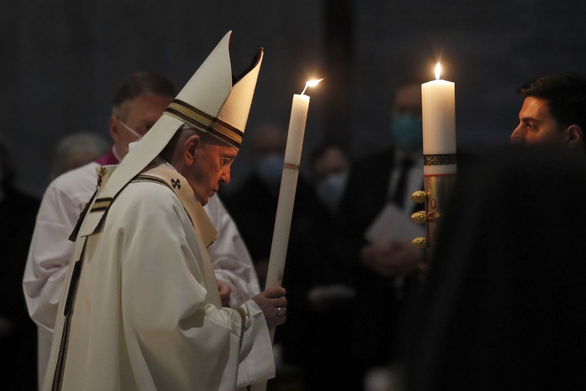 Pope Francis celebrates the Easter Vigil in a nearly empty St. Peter