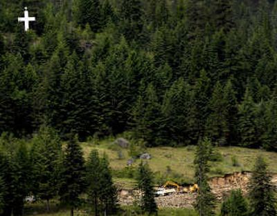 Work on an access road into Midas Mountain Estates above Garfield Bay has locals worried about falling rock and debris from blasting for the road. 
 (Brian Plonka / The Spokesman-Review)