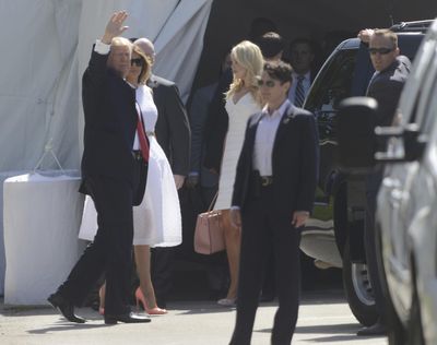 President Donald Trump, accompanied by first lady Melania Trump waves to onlookers as he enters Episcopal Church of Bethesda-by-the-Sea in Palm Beach, Fla., for an Easter Service, Sunday, April 16, 2017. ( (Joe Cavaretta / Associated Press)