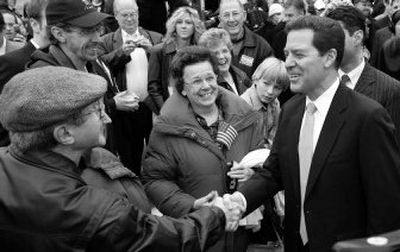
Sen. Sam Brownback greets supporters Saturday in Topeka, Kan., after announcing his plan to run for president. 
 (Associated Press / The Spokesman-Review)
