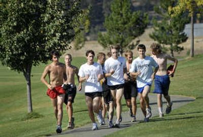 
The West Valley High boys cross country team warms up at Plantes Ferry Park on Tuesday.
 (Holly Pickett / The Spokesman-Review)