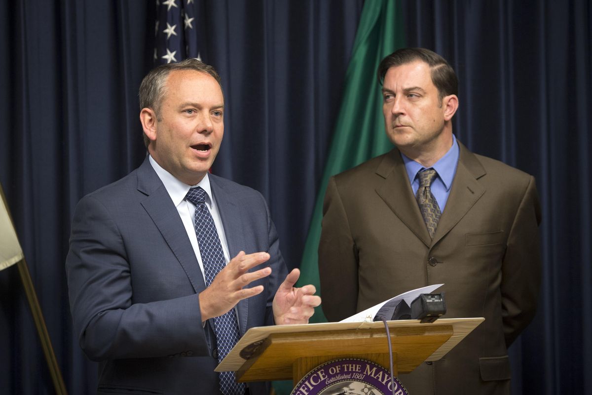 Spokane Mayor David Condon, left, with City Council President Ben Stuckart, at a news conference in September 2015. Condon vetoed last week a set of laws governing political contributions at the local level, pushed by Stuckart. The City Council will consider overriding that veto Monday. (Colin Mulvany / The Spokesman-Review)