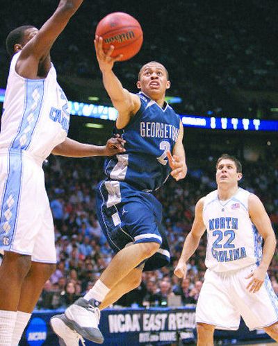 
Georgetown's Jonathan Wallace goes up for two against North Carolina during the East Regional championship game. 
 (Associated Press / The Spokesman-Review)