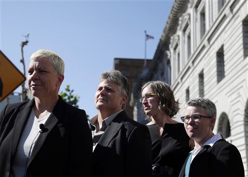 Sue Latta, from left, her partner Traci Ehlers, Sharene and Lori Watsen, from Boise, Idaho, all plaintiffs in a gay marriage case, gather to talk to the media outside 9th U.S. Circuit Court of Appeals on Monday, Sept. 8, 2014, in San Francisco. (AP / Marcio Jose Sanchez)