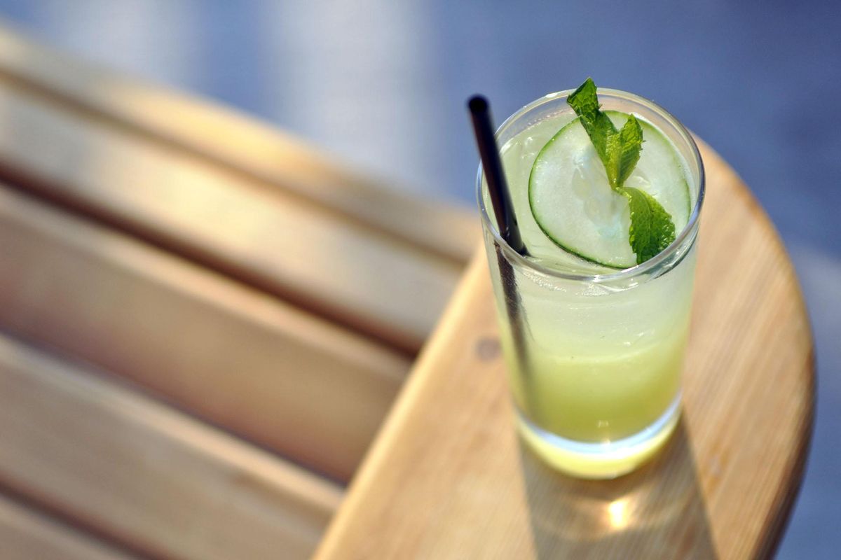 Grab an Adirondack chair on the patio at Park Lodge, and sip on the restaurant’s signature cucumber cooler, garnished with a thinly sliced cucumber round and mint sprig. (Adriana Janovich / The Spokesman-Review)