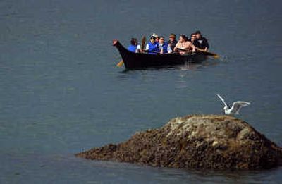 
Tulalip tribal members paddle a canoe around Tulalip Bay towing a device that measures water quality every two minutes. Associated Press photos
 (Associated Press photos / The Spokesman-Review)
