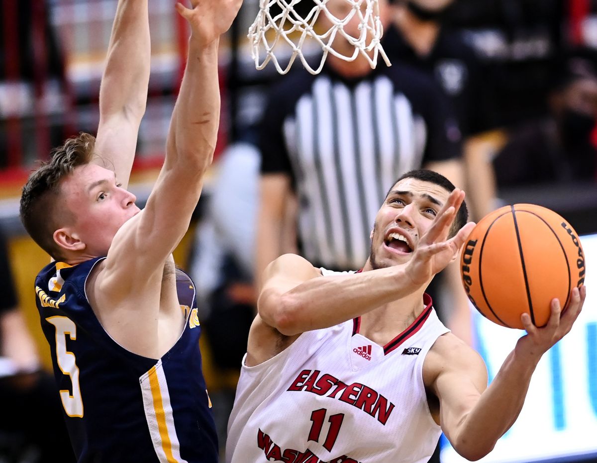 Eastern Washington Eagles guard Rylan Bergersen (11) drives to the hoop and scores against Northern Colorado Bears guard Dalton Knecht (5) during the second half of a college basketball game on Saturday, Jan 22, 2022, at Reese Court in Cheney, Wash. The Northern Colorado Bears won the game 87-83.  (Tyler Tjomsland/The Spokesman-Review)