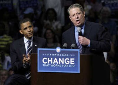 Democratic presidential candidate Sen. Barack Obama listens as former Vice President Al Gore speaks at Joe Louis Arena in Detroit Monday.  Gore announced his endorsement of Obama. Associated Press
 (Associated Press / The Spokesman-Review)