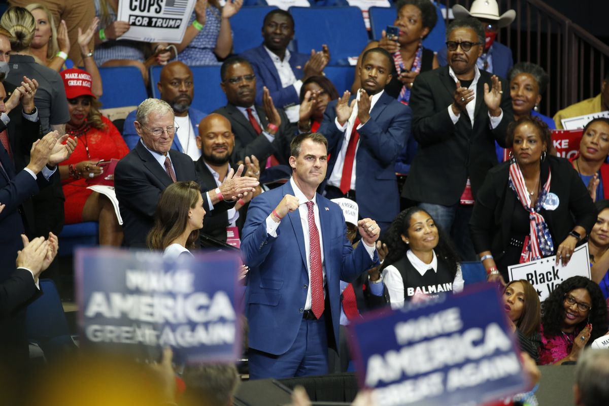 FILE - In this June 20, 2020 file photo, Oklahoma Gov. Kevin Stitt is recognized as President Donald Trump speaks during a campaign rally at the BOK Center, in Tulsa, Okla. Stitt announced Wednesday, July 15, 2020, that he