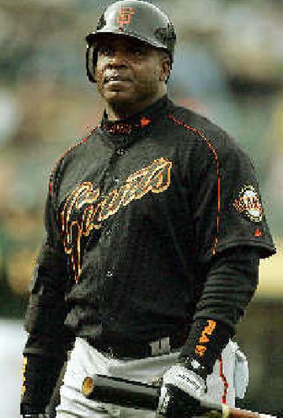 
Beleaguered Giants outfielder Barry Bonds continues his chase of Hank Aaron's home run record on Monday.
 (Associated Press / The Spokesman-Review)