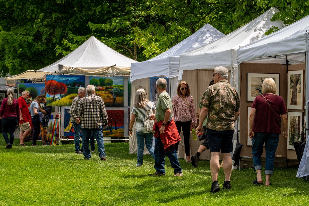 Visitors to the 37th annual ArtFest check out the variety of artist booths, Friday, June , 3, 2022.  (COLIN MULVANY/THE SPOKESMAN-REVI)