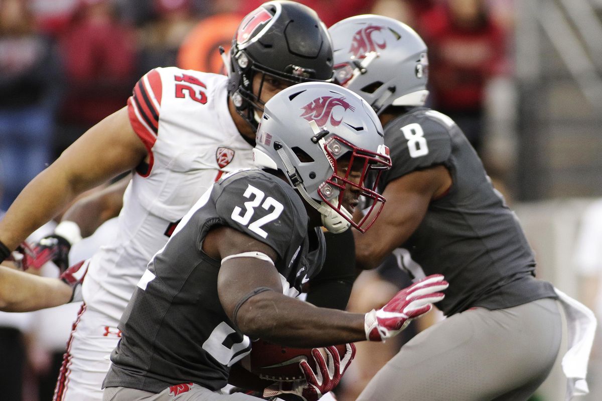 Washington State running back James Williams (32) runs with the ball during the second half of an NCAA college football game against Utah in Pullman, Wash., Saturday, Sept. 29, 2018. Washington State won 28-24. (Young Kwak / AP)
