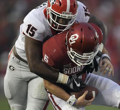 FILE - In this Jan. 1, 2018, file photo, Oklahoma quarterback Baker Mayfield (6) is sacked by Georgia linebacker D'Andre Walker (15), during the second half of the Rose Bowl NCAA college football game in Pasadena, Calif. Walker, a senior linebacker, has five of the team’s nine sacks and a team-high 10 quarterback hurries. (AP Photo/Mark J. Terrill, File) ORG XMIT: NY905 (Mark J. Terrill / AP)