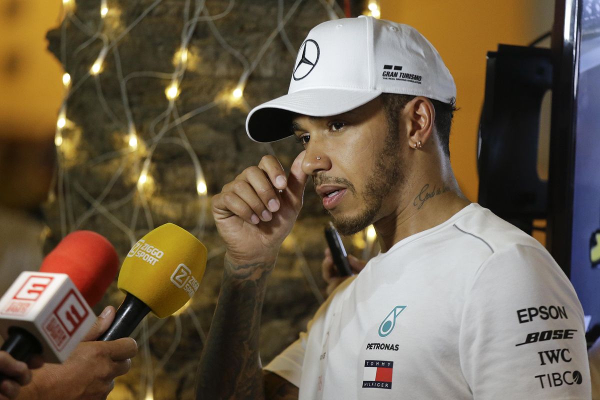 Mercedes driver Lewis Hamilton of Britain gestures as he answers to reporters after the qualifying session at the Formula One Bahrain International Circuit in Sakhir, Bahrain, Saturday, April 7, 2018. He sets the fourth fastest time. To compound Hamilton’s frustration, a five-place grid penalty for a gearbox change on Friday meant he starts Sunday’s race from ninth. (Luca Bruno / Associated Press)