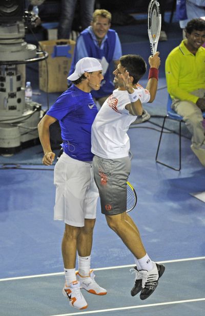 Novak Djokovic, right, and Rafael Nadal were in exhibition to raise funds for Haiti. (Associated Press)