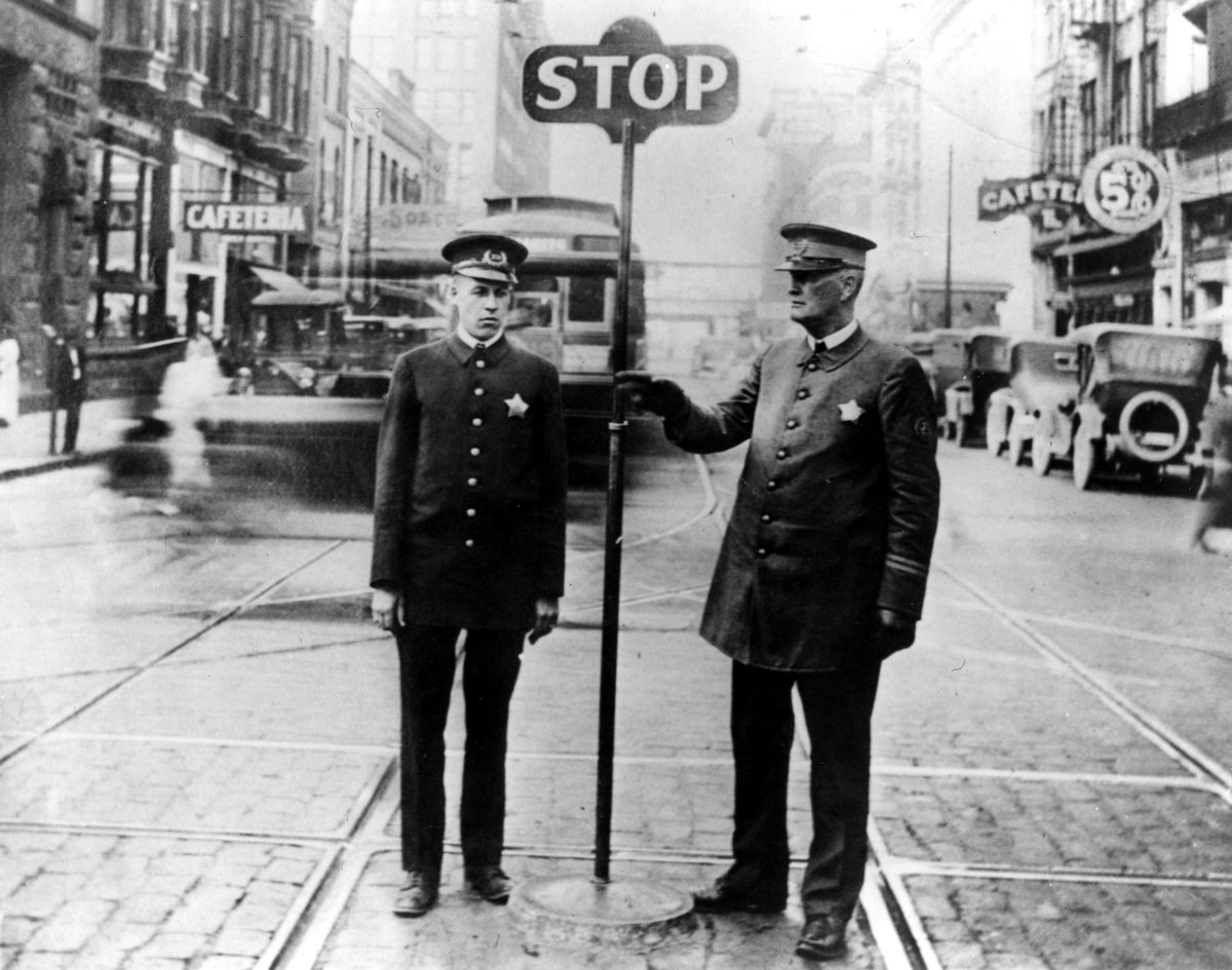 1923 : Denzil Cole, left, and his father, Charles, stand for a photo at Howard and Riverside in downtown Spokane. The older Cole moved his family to Spokane in 1905.