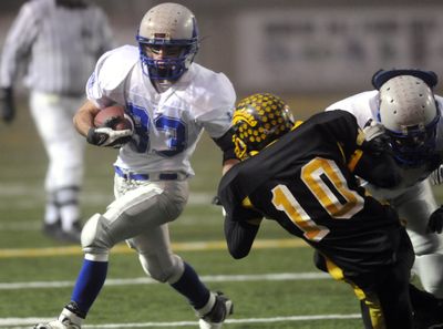 Garrett Blauert of LaCrosse-Washtucna-Kahlotus puts a move on Daniel Stang of Cusick.  (Jesse Tinsley / The Spokesman-Review)