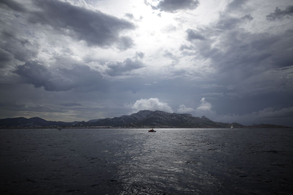 View from the 7th Continent expedition sailing ship as French President Emmanuel Macron with a delegation go admire the Calanques National Park, a marine reserve known for its azure blue waters overhung by high white cliffs, near Marseille, southern France, Friday Sept. 3, 2021. Macron is expected to urge the world to better protect biodiversity as key to fight climate change and support human welfare at a global summit starting Friday in southern France.  (Daniel Cole)