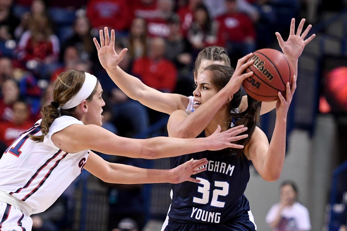 Brigham Young forward Kalani Purcell (32) looks to pass as Gonzaga Bulldogs guard Elle Tinkle (31) defends during the first half of an NCAA college basketball game, Thurs., Feb. 2, 2017, in the McCarthey Athletic Center. (Colin Mulvany / The Spokesman-Review)
