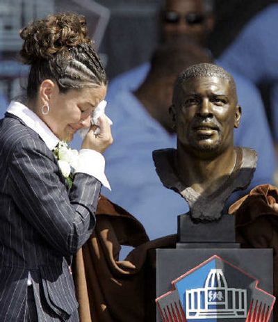 
Reggie White's widow, Sara, cries after unveiling his bust at the Hall of Fame ceremonies. 
 (Associated Press / The Spokesman-Review)