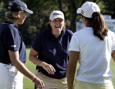 
Defending champion Meg Mallon, center, shares a laugh with Wendy Ward, left, of Edwall, Wash., and Laura Diaz. 
 (Associate Press / The Spokesman-Review)