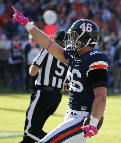 In this Saturday Oct. 22, 2016, file photo, Virginia tight end Evan Butts (46) celebrates a touchdown catch during the first half of an NCAA college football game between North Carolina and Virginia at Scott stadium in Charlottesville, Va. Butts, a senior tight end, caught 32 passes for 266 yards and two touchdowns last season, some as the second or third option on a play. That makes him the No. 2 returning receiver among tight ends in the Atlantic Coast Conference. (Steve Helber / Associated Press)