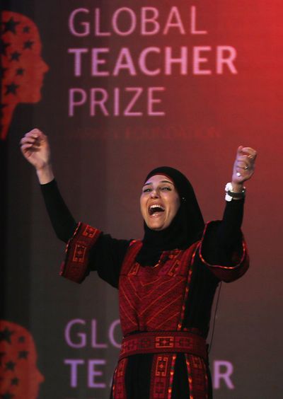 Palestinian primary school teacher Hanan al-Hroub reacts after she won the second annual Global Teacher Prize, in Dubai, United Arab Emirates, on Sunday. (Kamran Jebreili / Associated Press)