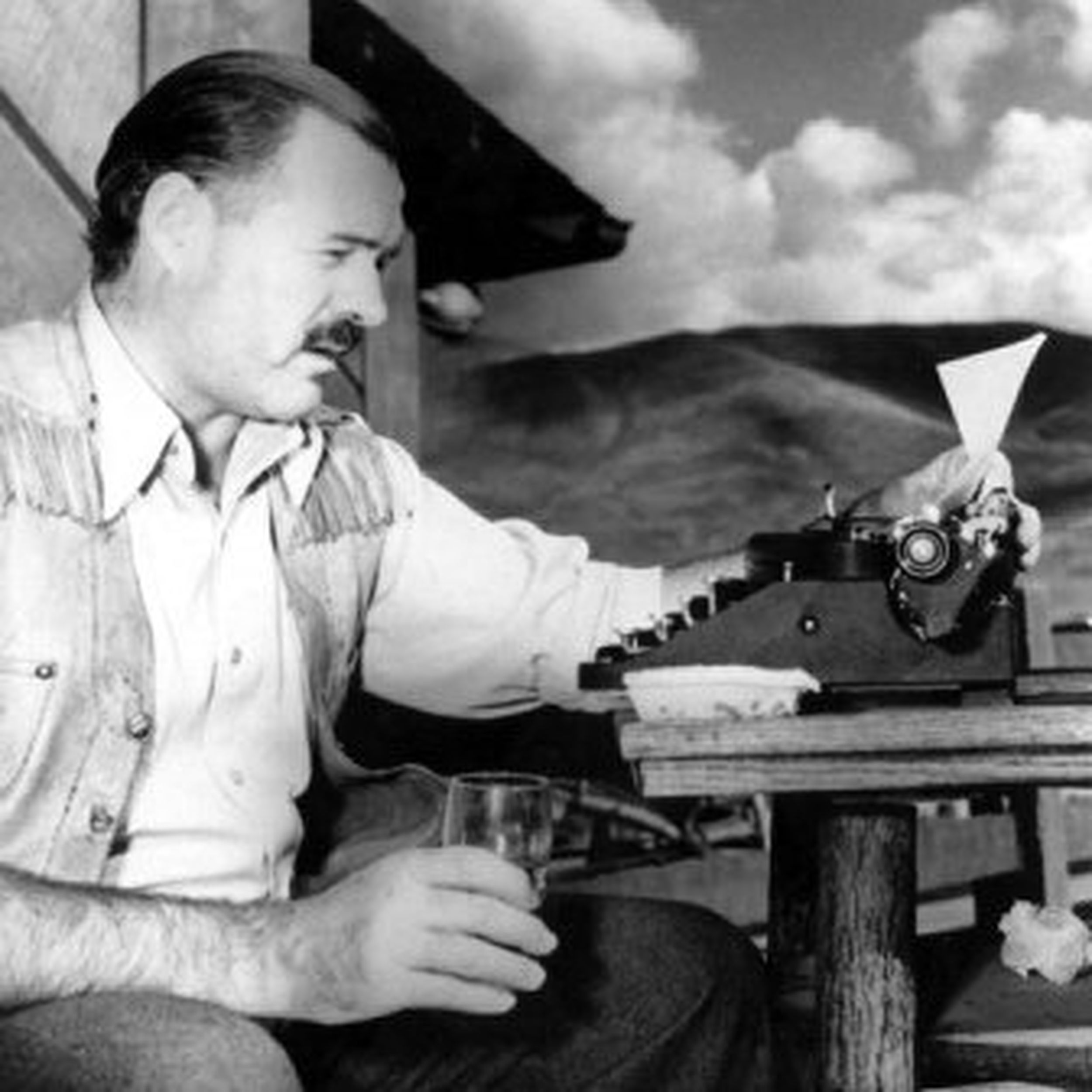 Ernst Hemingway looking in the trunk of his car, Sun Valley, Idaho]