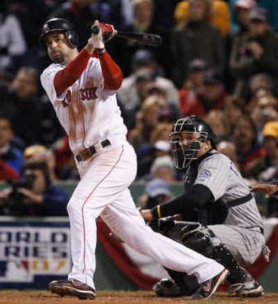 
Boston's Mike Lowell singles off Rockies'  Ubaldo Jimenez to drive in David Ortiz in the fifth inning for the winning run of Game 2.Associated Press
 (Associated Press / The Spokesman-Review)